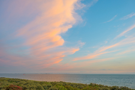 Clouds in a blue sky at sunset in summer