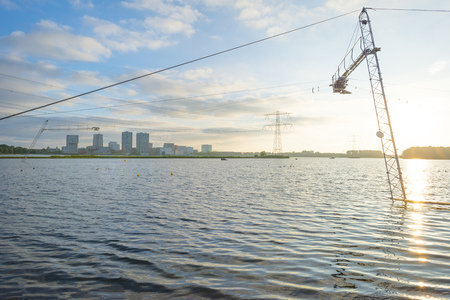 Skyline of a city along the shore of a lake at sunrise in springの写真素材