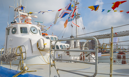 Show of sailing boats in a port in sunlight in springの写真素材