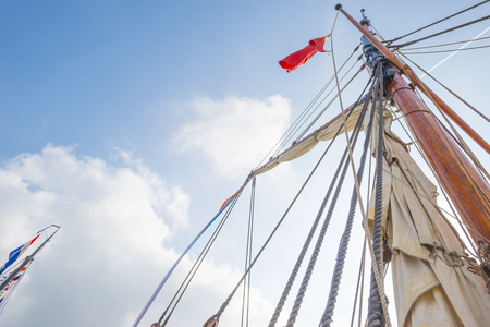Rigging or a tall ship in a port in sunlight in spring