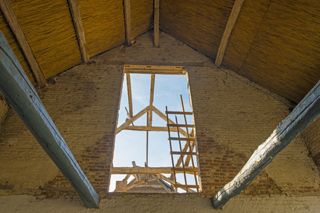 Construction of the interior of a barn in sunlight