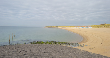 Beach along sea in sunlight at fallの写真素材