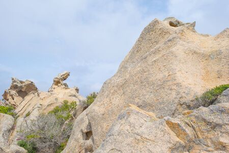 The "Cape of the Bear" formation of rocks in Palau in Sardinia below a blue skyの写真素材
