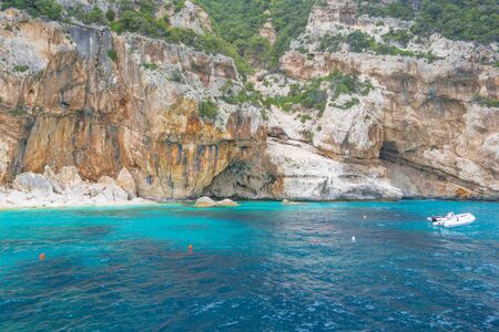 Rocky coast of the island of Sardinia in the Mediterranean Sea viewed from a boatの写真素材