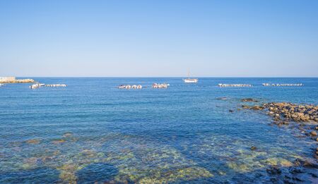 Rocky coast of the island of Sardinia in the Mediterranean Sea in sunlight in springの写真素材