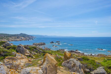 Rocky coast of the island of Sardinia in the Mediterranean Sea in sunlight in springの写真素材
