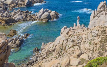 Rocky coast of the island of Sardinia in the Mediterranean Sea in sunlight in springの写真素材