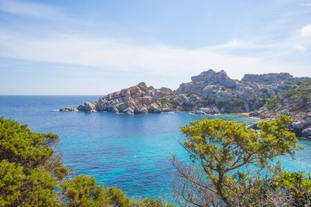Rocky coast of the island of Sardinia in the Mediterranean Sea in sunlight in springの写真素材