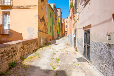 Colorful houses in the alleys of the town of Bosa in Sardinia in sunlight in springの写真素材