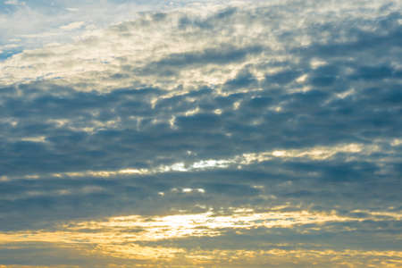 Panorama of white and gray clouds in a blue cloudy sky at sunrise in summer, Almere, Flevoland, The...