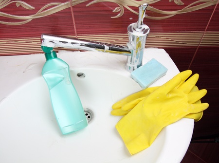 cleaning bathroom sink and fausetの写真素材