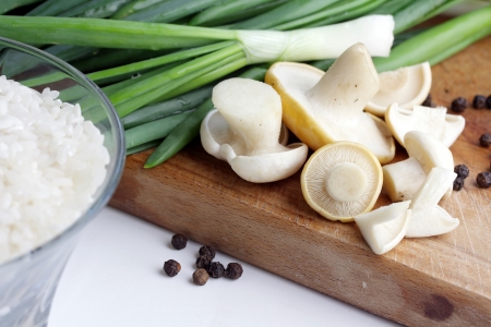 mushrooms, onion and cup of rice, focus on riseの写真素材