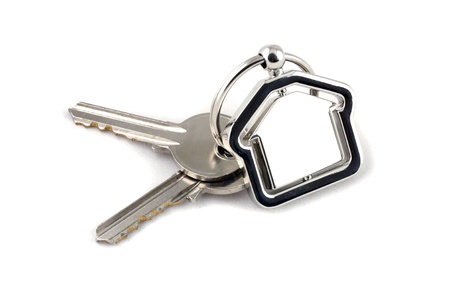 Macro view of two silver keys with red house figure on the white backgroundの写真素材