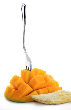 Fresh mango with fork isolated on a white backgroundの写真素材