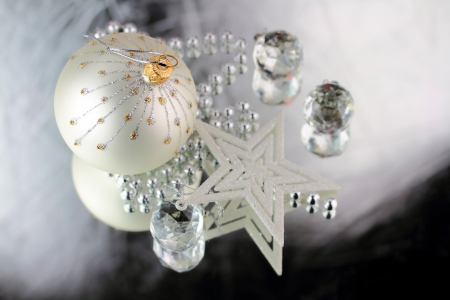 Christmas baubles, Cristal sphere and star on silver background with reflectionsの写真素材