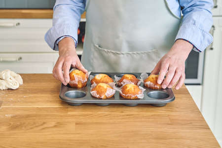 Men preparing muffin. Men cooking at home. Pastry conceptの写真素材