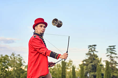 Funny performer showing trick with diaboloの写真素材