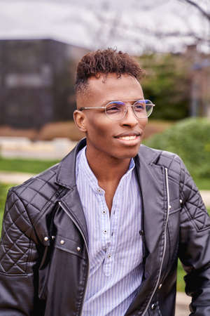 African American male model posing in a park looking at the horizon. High quality photoの写真素材