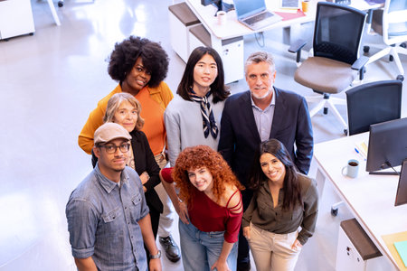 Diverse business team smiling while posing together in the office. Business concept.の写真素材