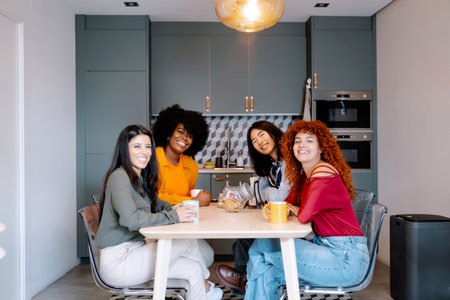 Work colleagues smiling while enjoying having a coffee break together in the office. Business concept.の写真素材