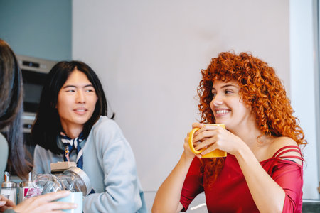 Coworkers chatting while having a coffee break together. Business concept.の写真素材