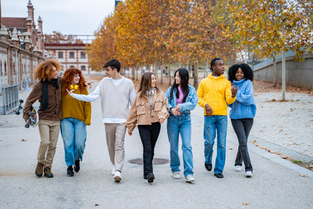 Multiethnic friends walking together outdoors. Friendship concept.の写真素材