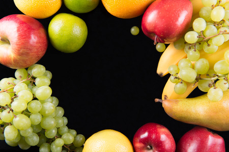 Fresh fruits on black backgroundの写真素材