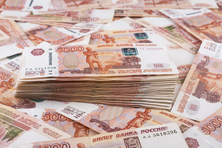 Heap of five thousand russian rubles banknotes as backgroundの写真素材