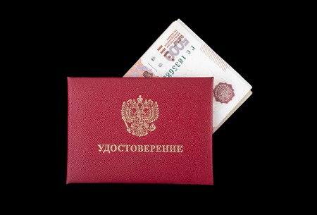Document identity with inserted russian money isolated on black backgroundの写真素材