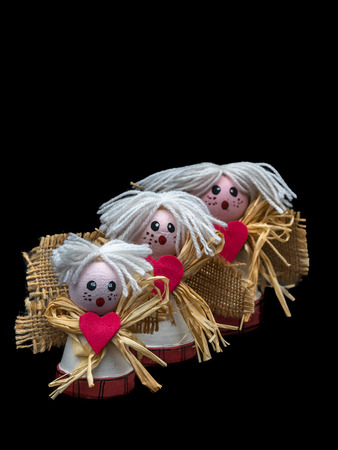 Ceramic angels, made at home with small pots, wool, coffee bags and rubber, with Christmas decorationの写真素材
