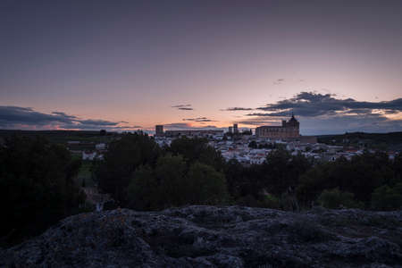 Cityscape of the village of UclÃ©s with the monastery and castle on top of the hill at sunset, Cuenca, Castilla La Mancha, Spainのeditorial素材