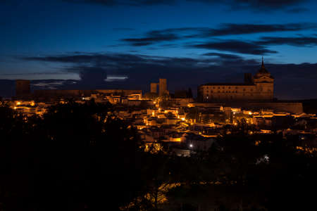 Cityscape of the illuminated town of UclÃ©s with the monastery and castle on top of the hill at night, Cuenca, Castilla La Mancha, Spainのeditorial素材