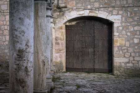 Wooden old brown door of a church in Cifuentes, Guadalajara, Spainの写真素材