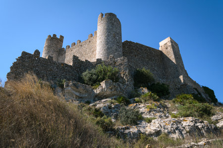 Medieval castle of Alcala de Chivert on a day with blue sky, Castellon, Spainの写真素材