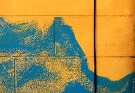 Yellow Blue Brick Wall Urban Street Artの写真素材