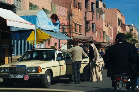Marrakesh (Morocco) 6th January 2010.- Open air popular market in Marrakesh.- Getiing into a taxiのeditorial素材