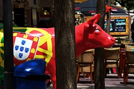 Albufeira (Portugal) 18th May 2013: Street photo: Portugal cow and flagのeditorial素材