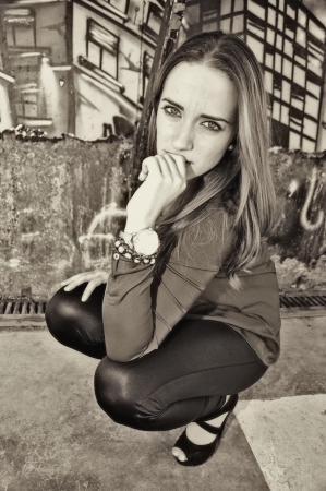 Squatting girl  の写真素材