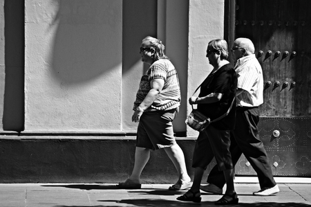 Seville, Spain, 18th August, 2014 - Urban life XI - People walkig in the streetのeditorial素材
