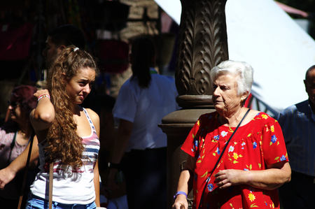 Spain, Seville, 10th September, 2014. Urban life. Old and young ladiesのeditorial素材