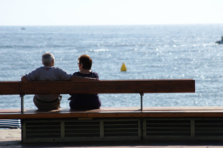 Blanes (Girona) Spain - 19-10-2014 Urban life - Couple by the beachのeditorial素材