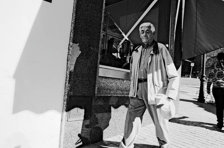 Carmona, Seville, Spani, 6th November 2014 Urban life - Man walking in the street 1のeditorial素材