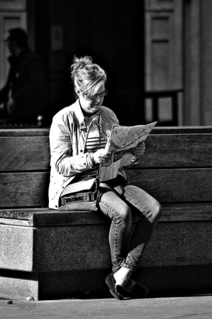 Seville (Spain) 29th November 2014 Urban Life 48 - Lady reading in the street. Grey variationのeditorial素材
