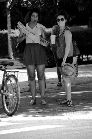 Sevilla - Spain - 19 July 2015 Urban life - Ladies looking at a map in the streetのeditorial素材