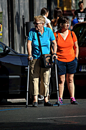 Sevilla - Spain - 19 July 2015 Urban life - Lady with crutches in the streetのeditorial素材