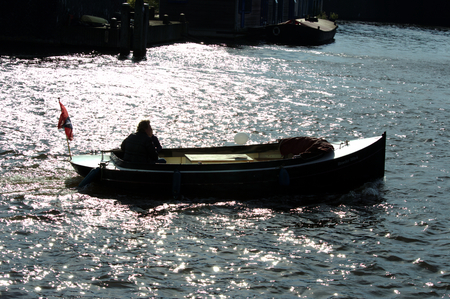 Man and moat in the canalの写真素材