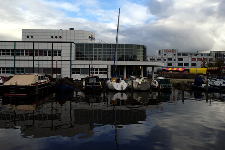 Netherlands, Alkmaar, 9th October 2015 Canal  against a cloudy skyのeditorial素材
