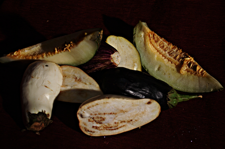 Still life with eggplants and a melonの写真素材