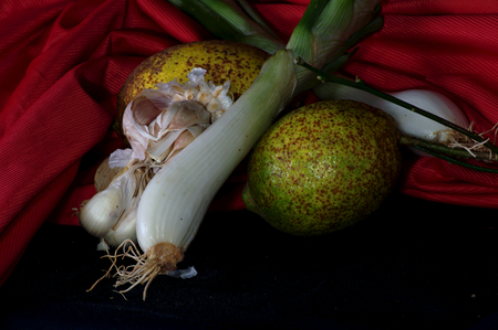 Garlic, cebolletqa and lemonsの写真素材