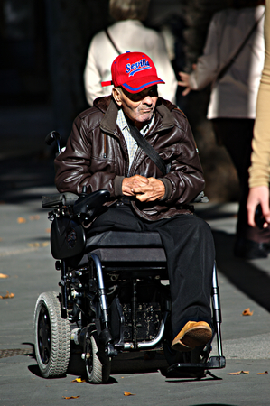 Sevilla, Spain, 11th September 2015 - Urban life - Man sittingon a wheelchairのeditorial素材
